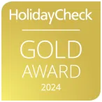 Ihr seht die Auszeichnung des HolidayCheck Gold Awards für das Jahr 2024.