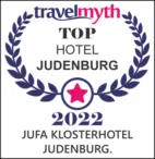 Ihr seht das Logo von Travelmyth mit der Auszeichnung Top Hotel 2022.