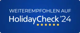 Ihr seht das Logo "Weiterempfehlung" von HolidayCheck 2024.